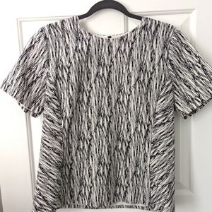Short sleeved zip back blouse